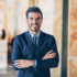 Businessman with arms crossed looking at camera